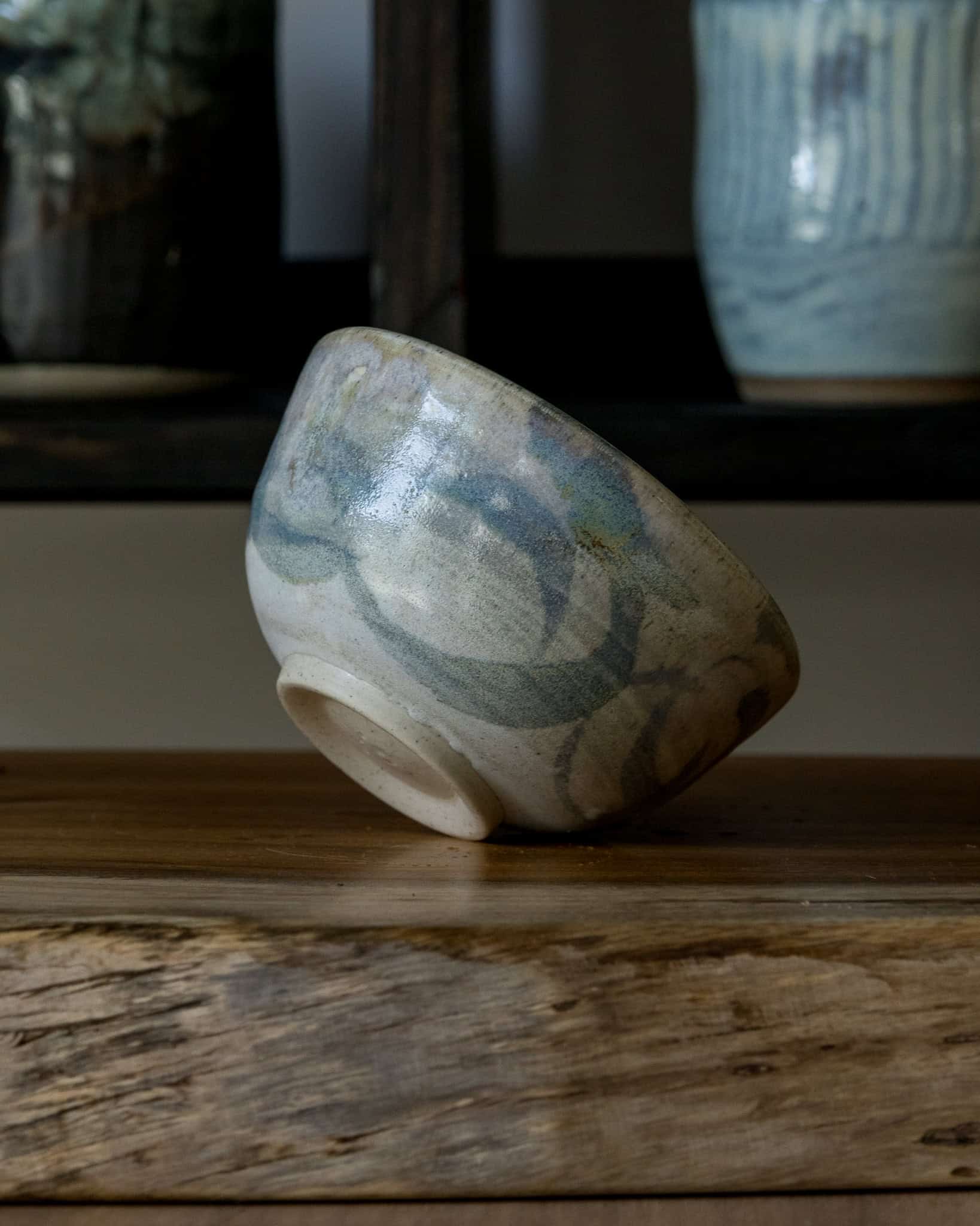 Matte grey ceramic bowl with pale blue swirls