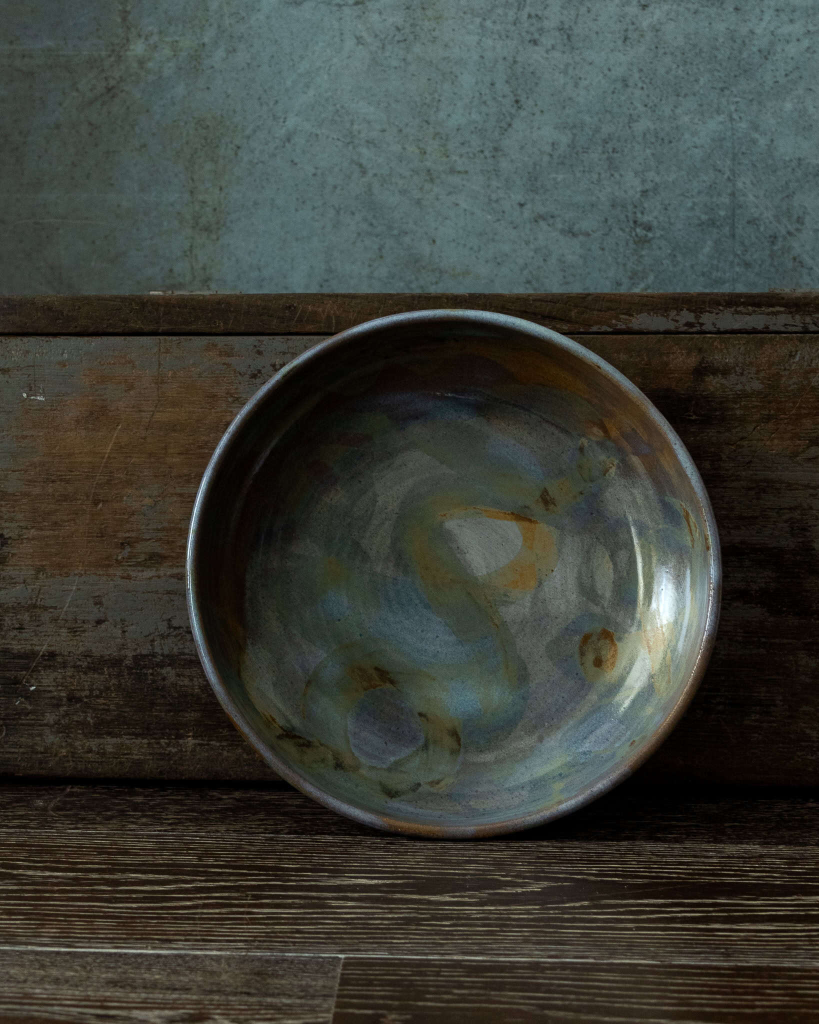 Handmade serving bowl with abstract pattern. Opalescent Blue over Matte Grey base with iron swirls